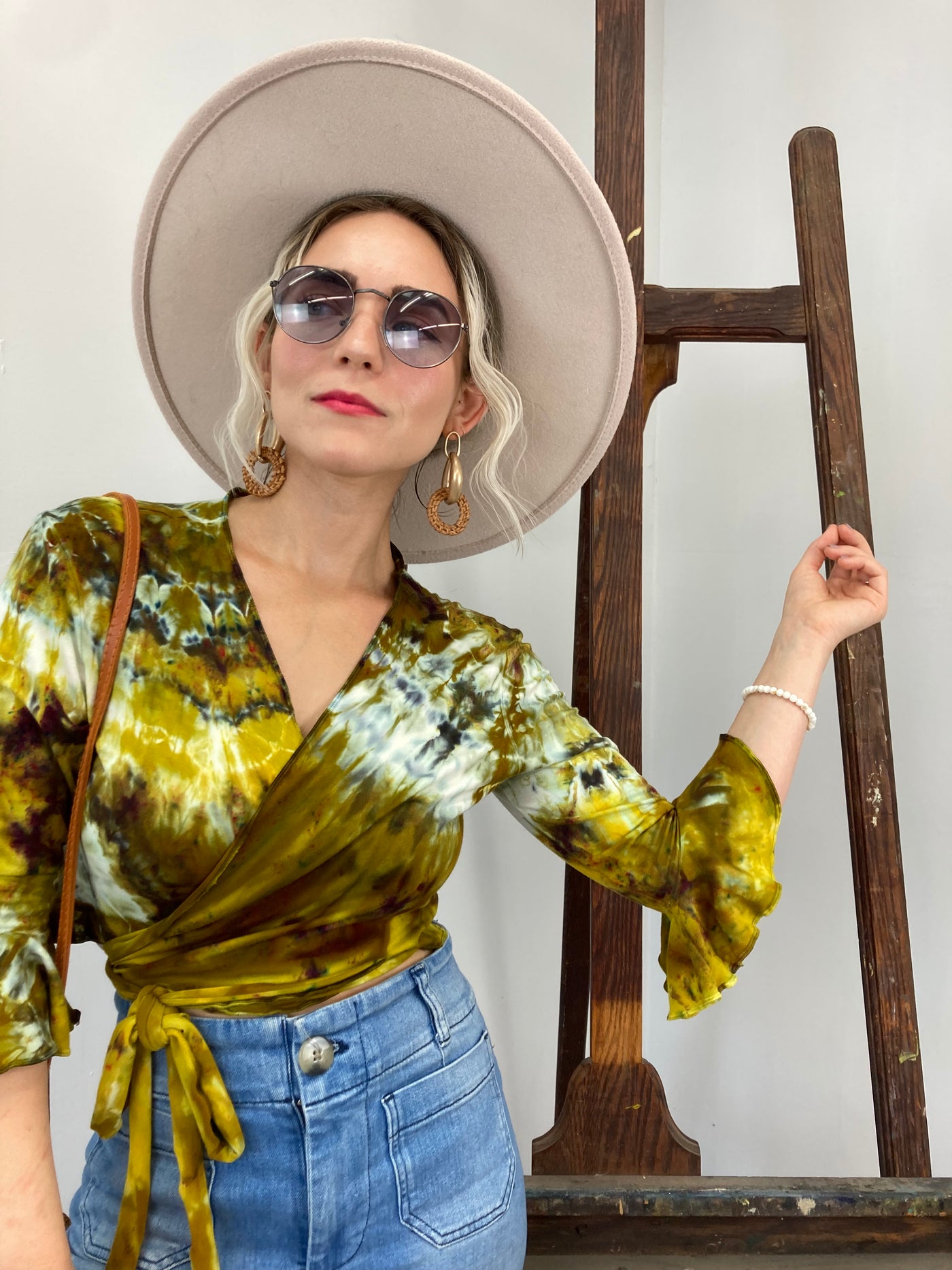 Flamenco Wrap Top in Bombay to Dijon is a petite length wrap top with 3/4 length sleeves that end in a flounce.  Golden, mustard and cream tones on soft washable bamboo/cotton/spandex jersey fabric - pictured on model