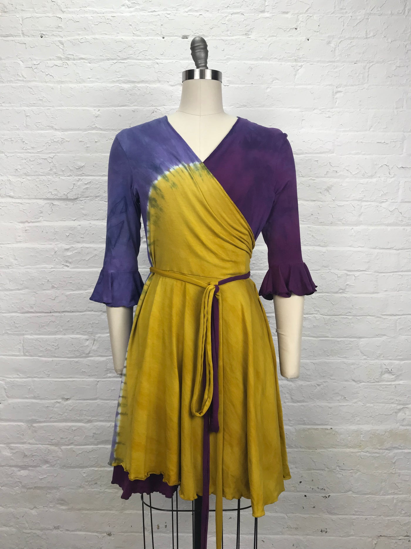 Flamenco Wrap Dress in Violet Sunrise - Soft to the touch bamboo jersey fabric makes this knee length wrap dress in gold and violet - front view