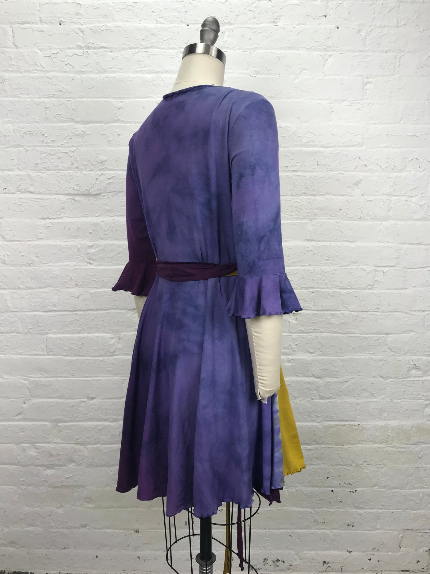 Flamenco Wrap Dress in Violet Sunrise - Soft to the touch bamboo jersey fabric makes this knee length wrap dress in gold and violet - right back view