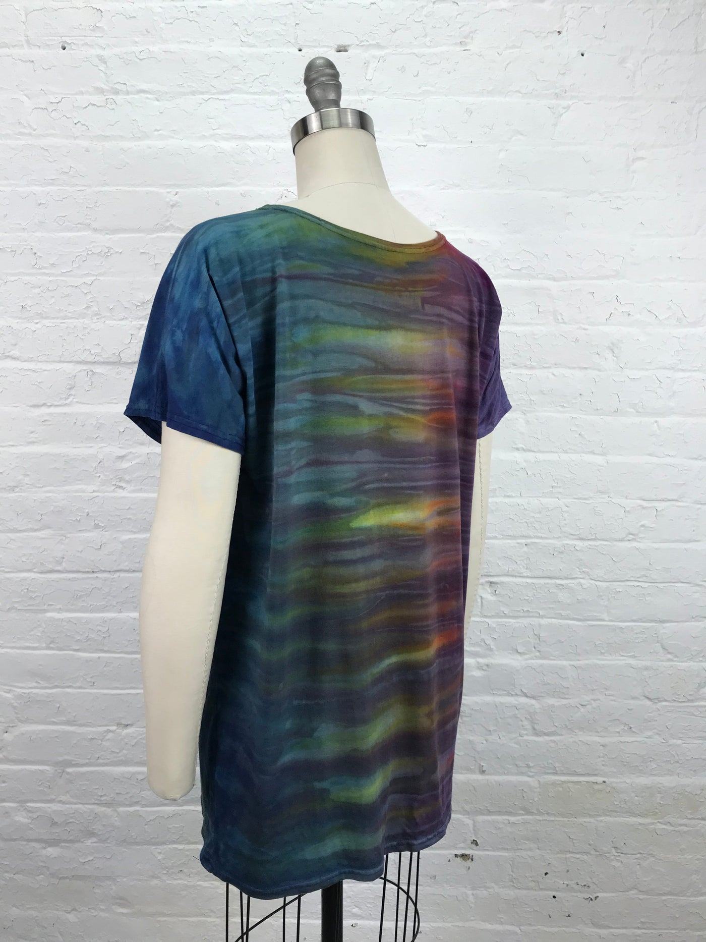 Astrid Mini in Spectro - a short sleeve, loose cut tunic in rainbow tones, made of cozy bamboo jersey which feels great on the skin - size S/M -back view