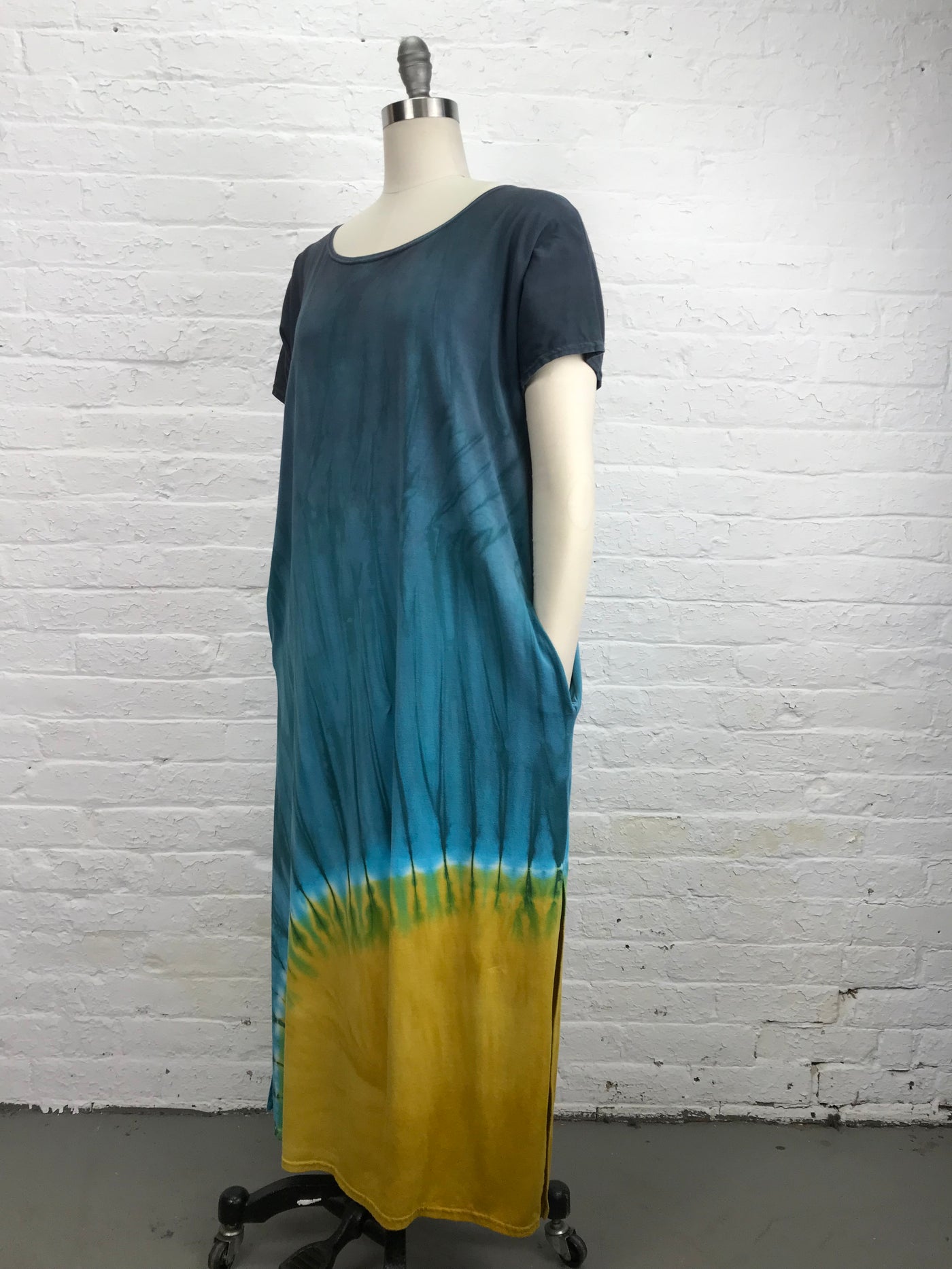 The Astrid Maxi Dress in Sunshine has pockets and is hand dyed in gold and turquoise ombre