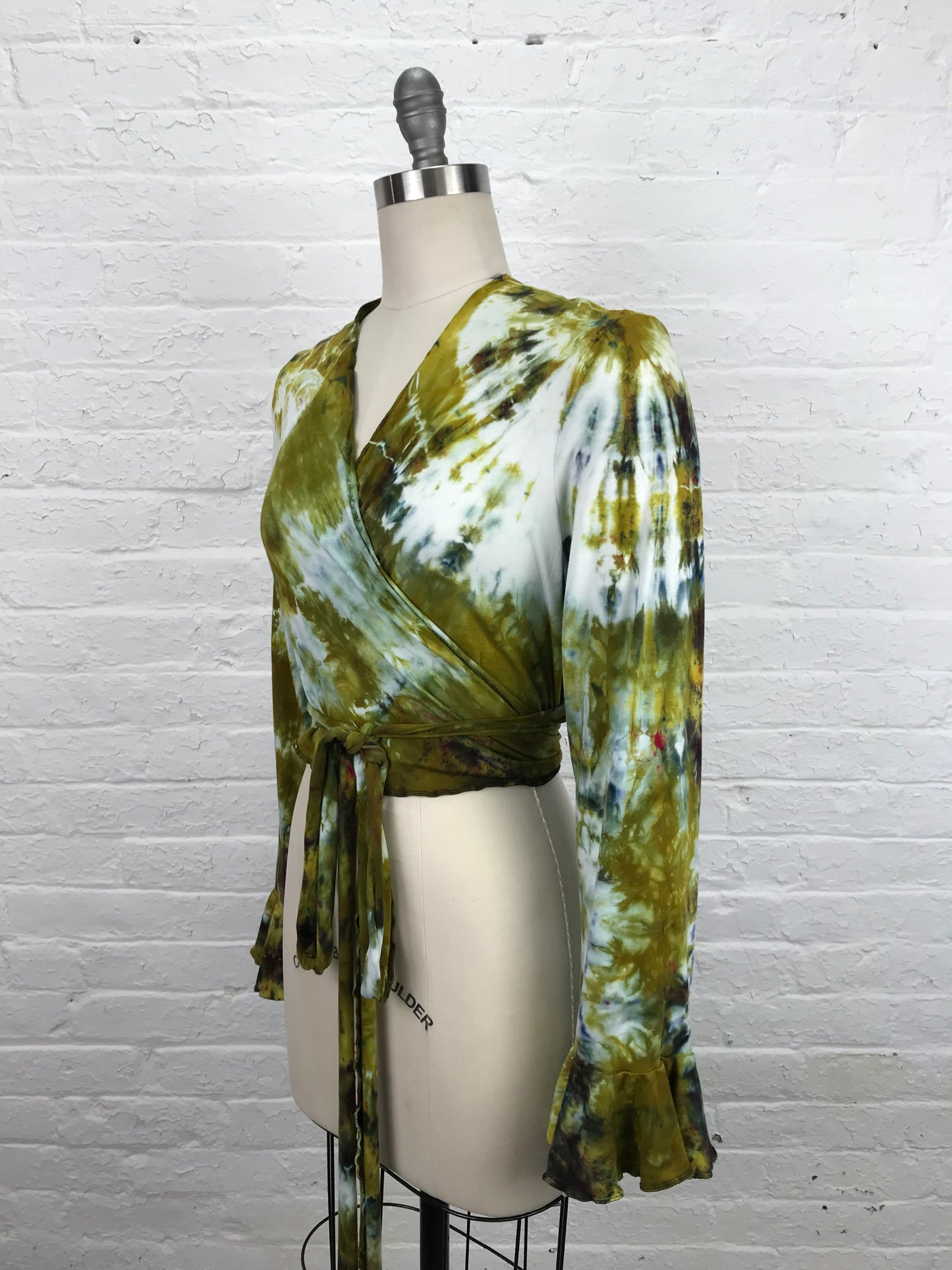 Flamenco Wrap Top in Bombay to Dijon is a petite length wrap top with long sleeves that end in a flounce.  Golden, mustard and cream tones on soft washable bamboo/cotton/spandex jersey fabric - side view