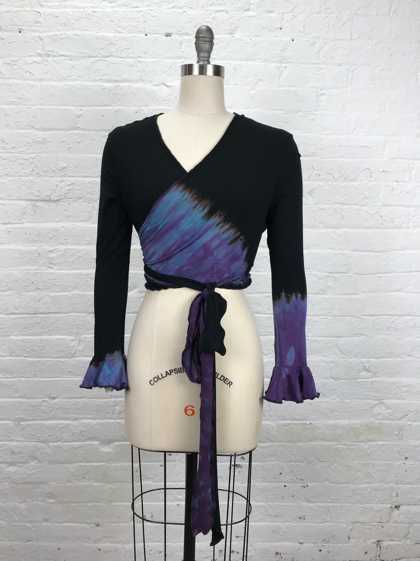 Flamenco Wrap Top in Black and Blue - front view